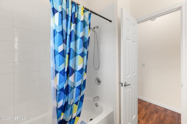 109 N Peachtree St, Hastings, FL 32145 - full bath with shower / tub combo with curtain, wood finished floors, and baseboards
