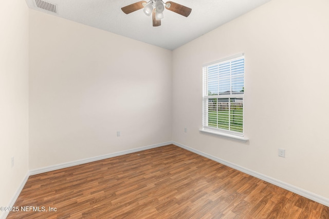 109 N Peachtree St, Hastings, FL 32145 - spare room featuring wood finished floors, baseboards, and ceiling fan