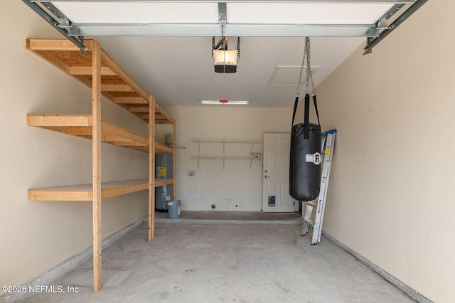 109 N Peachtree St, Hastings, FL 32145 - garage featuring electric water heater, a garage door opener, and baseboards