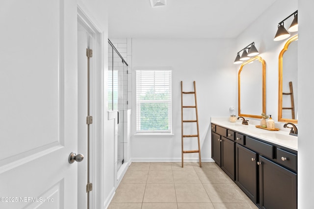 full bath featuring tile patterned floors, an enclosed shower, double vanity, and baseboards