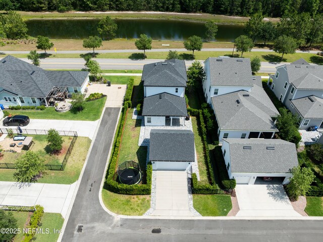 aerial view of residential area with a large body of water