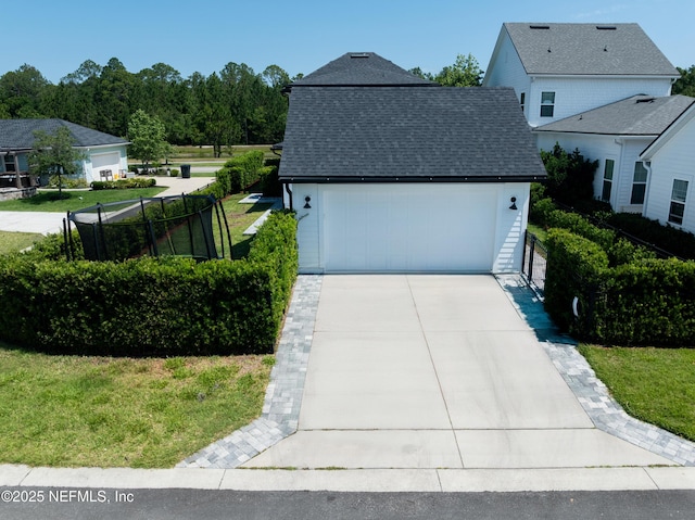 view of home's exterior with a shingled roof and concrete driveway