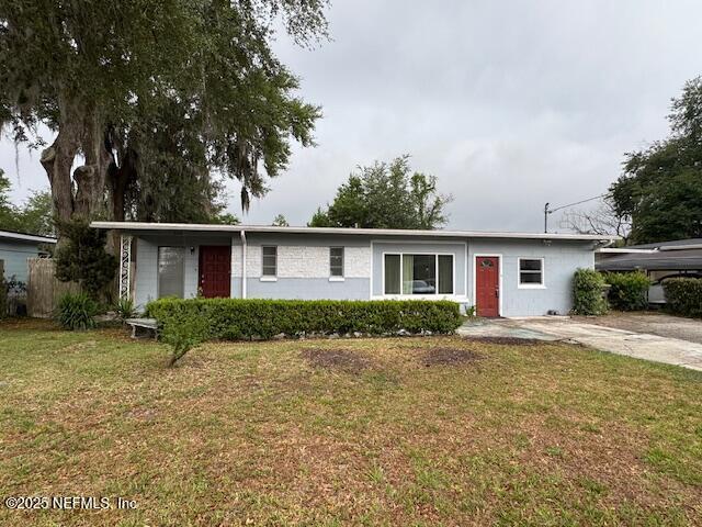 6332 Badnur Dr, Jacksonville, FL 32210 - ranch-style home with a front lawn