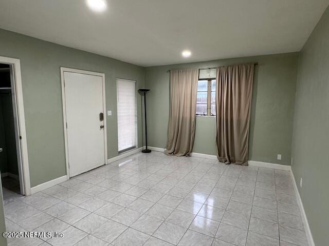 6332 Badnur Dr, Jacksonville, FL 32210 - empty room featuring light tile patterned floors, baseboards, and recessed lighting
