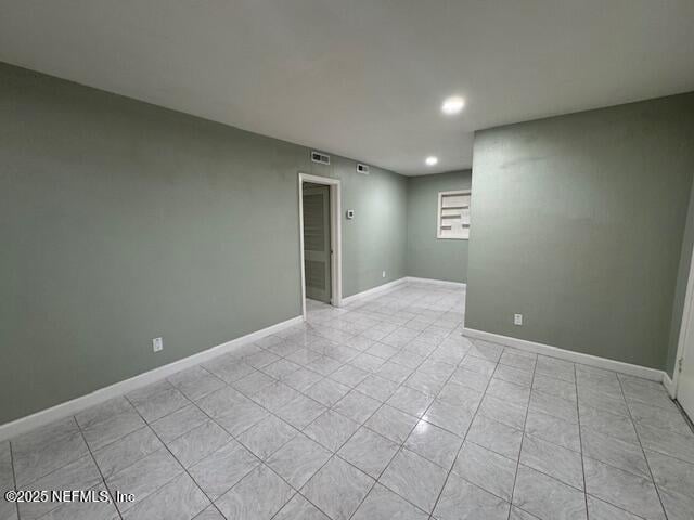 6332 Badnur Dr, Jacksonville, FL 32210 - empty room with recessed lighting, baseboards, and light tile patterned floors