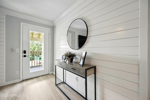 100 Fairway Park Blvd Unit 1809, Ponte Vedra Beach, FL 32082 - doorway to outside featuring crown molding, wood finished floors, a textured ceiling, baseboards, and wood walls