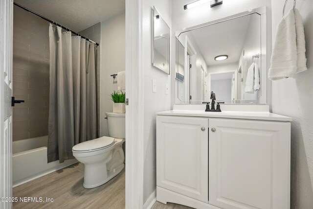 100 Fairway Park Blvd Unit 1809, Ponte Vedra Beach, FL 32082 - bathroom with wood finished floors, toilet, vanity, and shower / tub combo with curtain