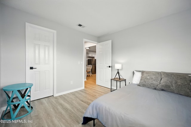 100 Fairway Park Blvd Unit 1809, Ponte Vedra Beach, FL 32082 - bedroom with freestanding refrigerator, wood finished floors, and baseboards