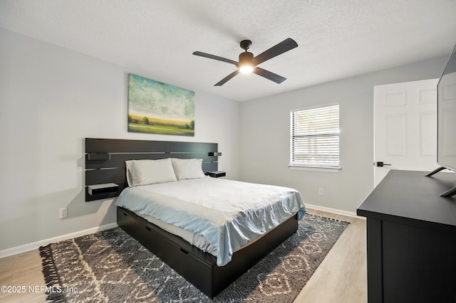 100 Fairway Park Blvd Unit 1809, Ponte Vedra Beach, FL 32082 - bedroom with wood finished floors, baseboards, a textured ceiling, and ceiling fan