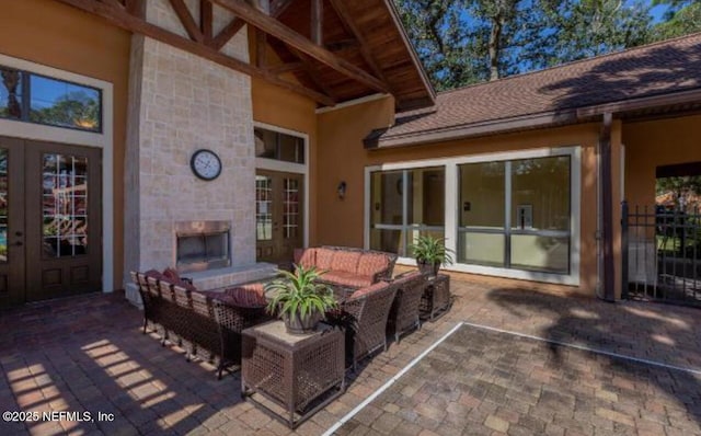 100 Fairway Park Blvd Unit 1809, Ponte Vedra Beach, FL 32082 - view of patio / terrace with french doors and an outdoor living space with a fireplace