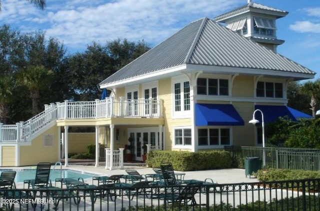 100 Fairway Park Blvd Unit 1809, Ponte Vedra Beach, FL 32082 - back of property with a patio area, fence, metal roof, and stairs