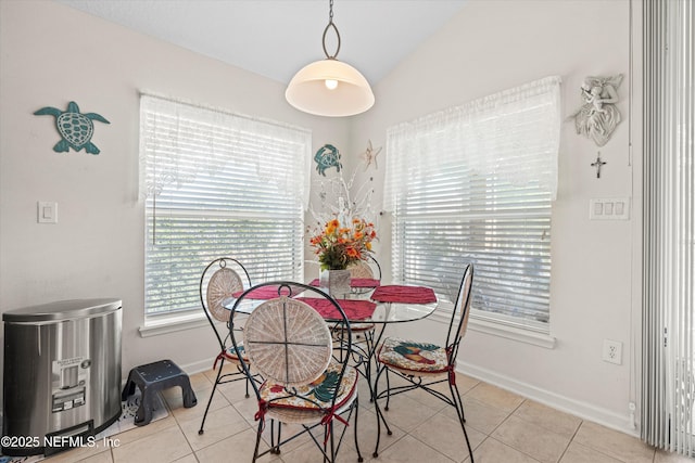 6750 White Blossom Cir Unit 36A, Jacksonville, FL 32258 - dining area featuring vaulted ceiling, baseboards, and tile patterned floors