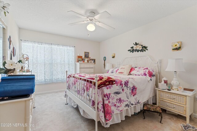 6750 White Blossom Cir Unit 36A, Jacksonville, FL 32258 - bedroom with a textured ceiling, carpet floors, a ceiling fan, and baseboards