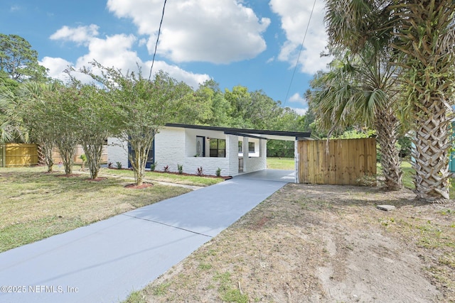 5444 Keystone Dr S, Jacksonville, FL 32207 - view of front of home featuring concrete driveway, a carport, and brick siding