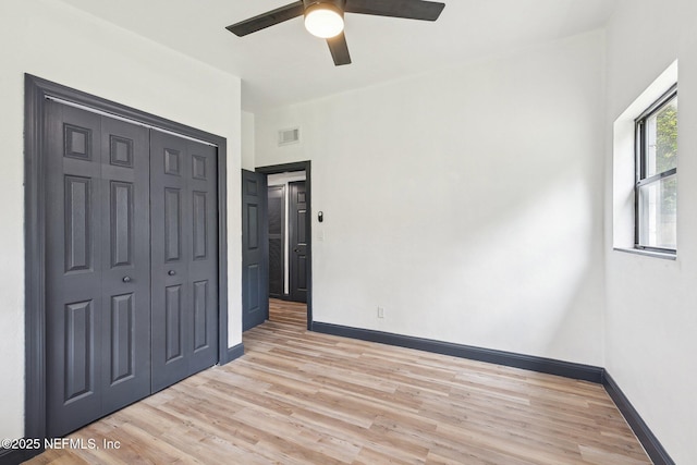 5444 Keystone Dr S, Jacksonville, FL 32207 - unfurnished bedroom featuring light wood-style floors, baseboards, a closet, and ceiling fan
