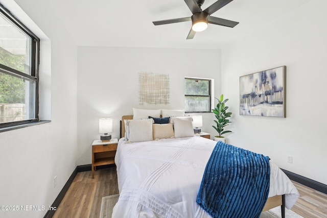 5444 Keystone Dr S, Jacksonville, FL 32207 - bedroom with wood finished floors, baseboards, and a ceiling fan