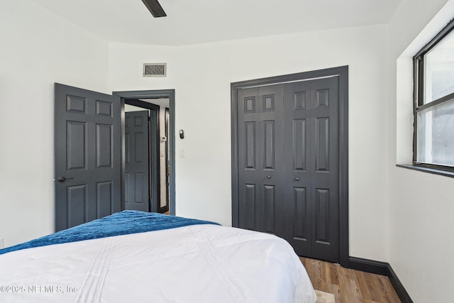 5444 Keystone Dr S, Jacksonville, FL 32207 - bedroom with wood finished floors, a closet, baseboards, and ceiling fan