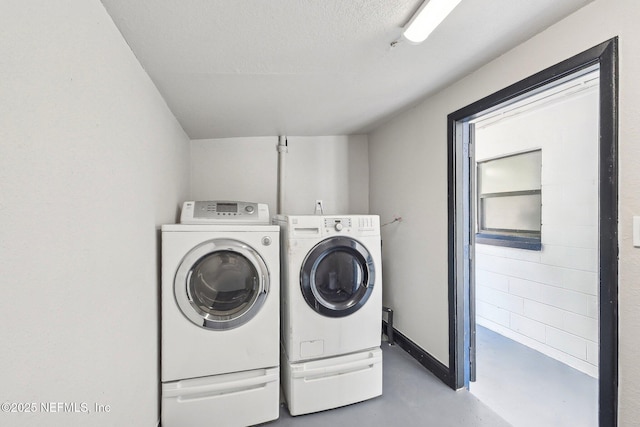 5444 Keystone Dr S, Jacksonville, FL 32207 - washroom featuring washing machine and clothes dryer and a textured ceiling