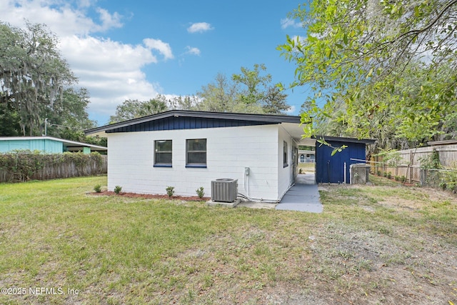 5444 Keystone Dr S, Jacksonville, FL 32207 - back of property with central AC unit, a shed, and an outbuilding