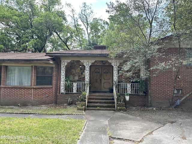 1410 Lila Ave, Jacksonville, FL 32208 - view of front of property featuring a porch and brick siding