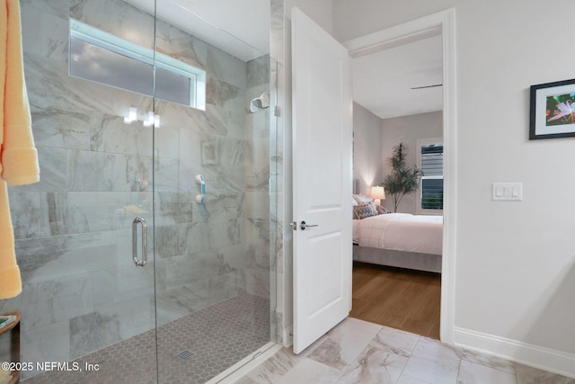 181 Lamego Ln, Saint Augustine, FL 32095 - bathroom featuring ensuite bathroom, a shower stall, marble finish floors, and baseboards