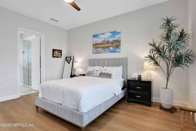 181 Lamego Ln, Saint Augustine, FL 32095 - bedroom featuring light wood-type flooring, baseboards, ensuite bath, and ceiling fan