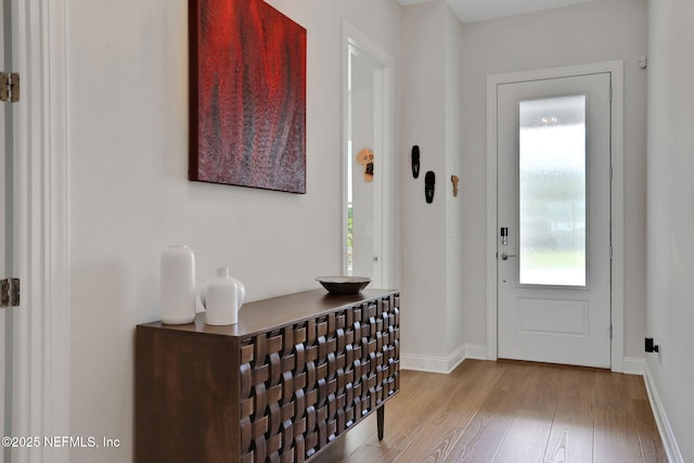 181 Lamego Ln, Saint Augustine, FL 32095 - foyer entrance with light wood-style floors and baseboards