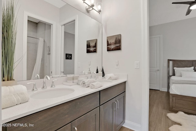 181 Lamego Ln, Saint Augustine, FL 32095 - full bath featuring double vanity, wood finished floors, a ceiling fan, and curtained shower