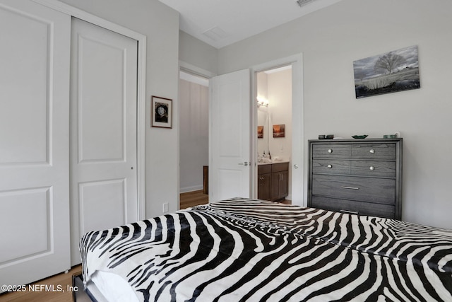 181 Lamego Ln, Saint Augustine, FL 32095 - bedroom with wood finished floors and connected bathroom