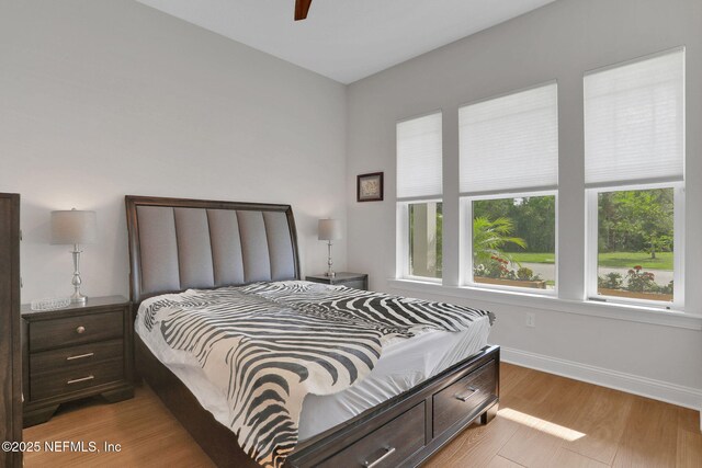181 Lamego Ln, Saint Augustine, FL 32095 - bedroom featuring light wood-style flooring, baseboards, and a ceiling fan