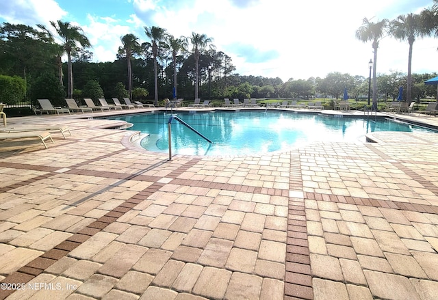 181 Lamego Ln, Saint Augustine, FL 32095 - community pool featuring a patio area and view of scattered trees