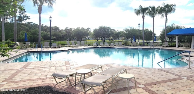 181 Lamego Ln, Saint Augustine, FL 32095 - community pool with a patio and fence