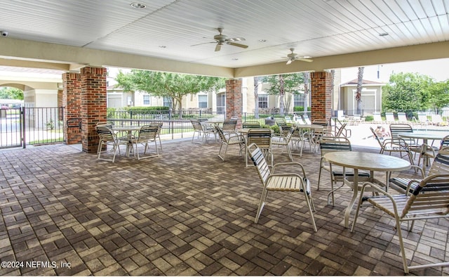 7801 Point Meadows Dr Unit 1108, Jacksonville, FL 32256 - view of patio / terrace featuring outdoor dining area, fence, and ceiling fan