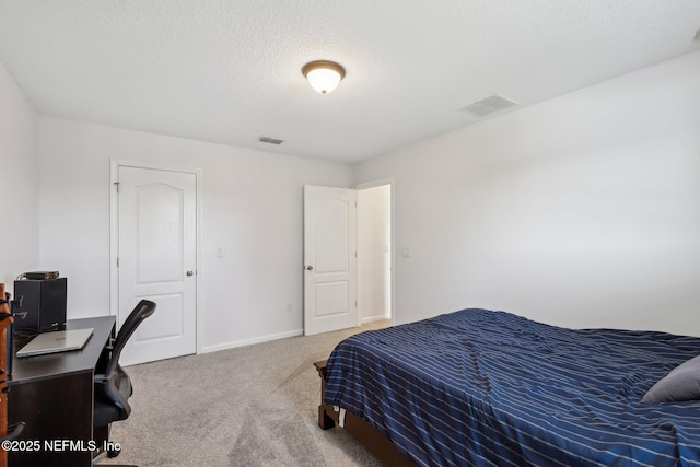 1500 Calming Water Dr Unit 3504, Fleming Island, FL 32003 - carpeted bedroom with a desk, baseboards, and a textured ceiling