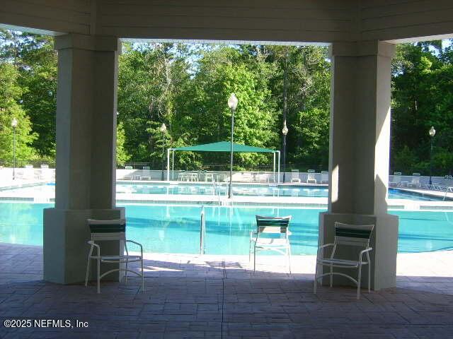 1500 Calming Water Dr Unit 3504, Fleming Island, FL 32003 - community pool with view of wooded area