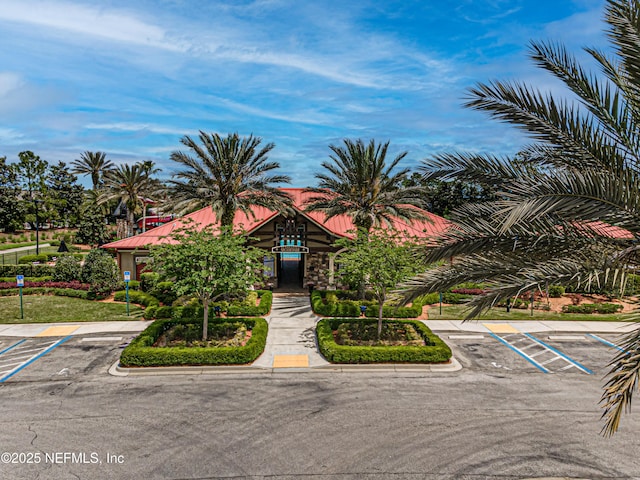 1500 Calming Water Dr Unit 3504, Fleming Island, FL 32003 - view of front facade with uncovered parking and metal roof