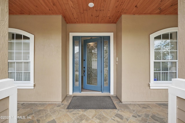 5279 Cattle Crossing Way, Jacksonville, FL 32226 - doorway to property with stucco siding