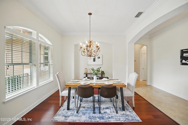 5279 Cattle Crossing Way, Jacksonville, FL 32226 - dining space featuring crown molding, arched walkways, dark wood-type flooring, and visible vents
