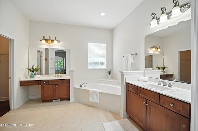 5279 Cattle Crossing Way, Jacksonville, FL 32226 - bathroom with a sink, a walk in closet, two vanities, and a bath