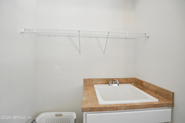 5279 Cattle Crossing Way, Jacksonville, FL 32226 - laundry area with a sink