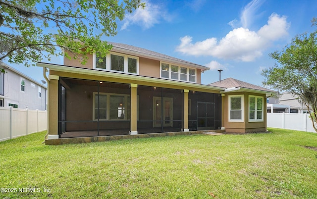 5279 Cattle Crossing Way, Jacksonville, FL 32226 - back of house featuring a yard, a sunroom, a fenced backyard, and stucco siding
