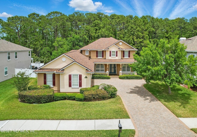 5279 Cattle Crossing Way, Jacksonville, FL 32226 - view of front of home featuring a porch, a front lawn, and decorative driveway