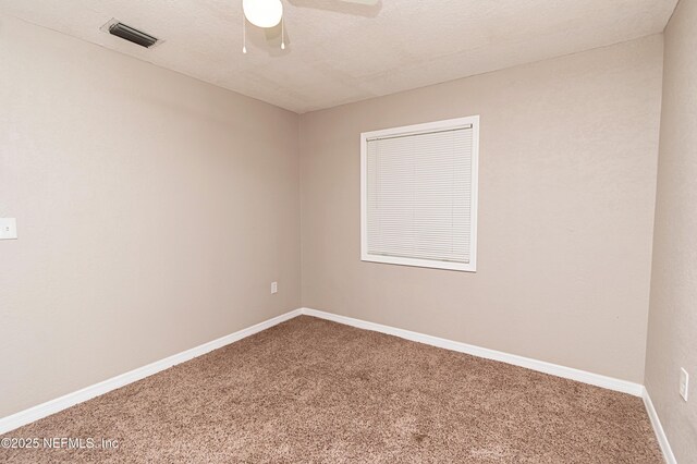 610 S 9th St, Macclenny, FL 32063 - carpeted empty room featuring a ceiling fan, baseboards, and visible vents