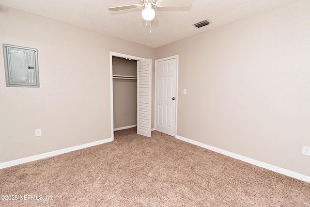 610 S 9th St, Macclenny, FL 32063 - unfurnished bedroom featuring electric panel, a closet, light colored carpet, visible vents, and baseboards