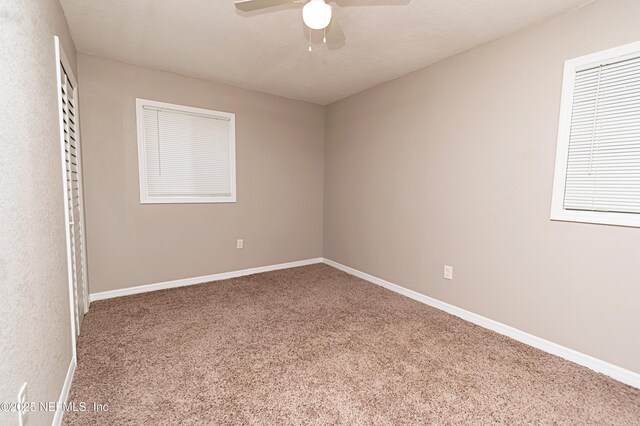 610 S 9th St, Macclenny, FL 32063 - spare room with a ceiling fan, baseboards, and carpet