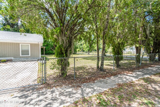 610 S 9th St, Macclenny, FL 32063 - view of yard featuring a gate and fence