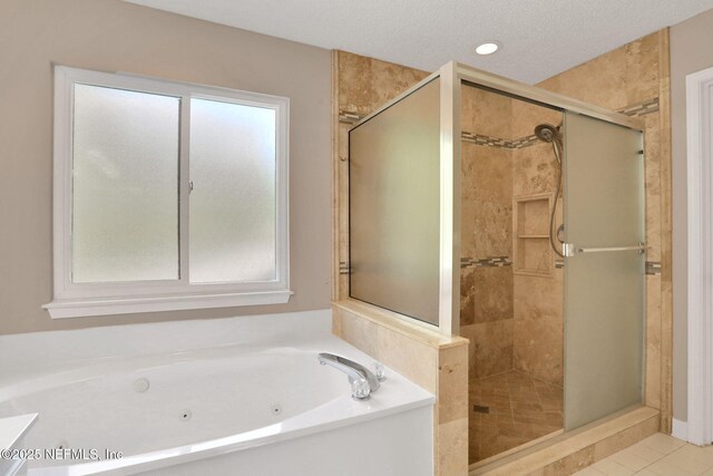 12602 Wimica Ln, Jacksonville, FL 32218 - bathroom featuring a stall shower, a jetted tub, tile patterned flooring, and recessed lighting