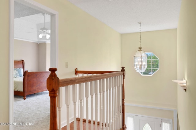 12602 Wimica Ln, Jacksonville, FL 32218 - staircase with a ceiling fan, carpet, and a chandelier