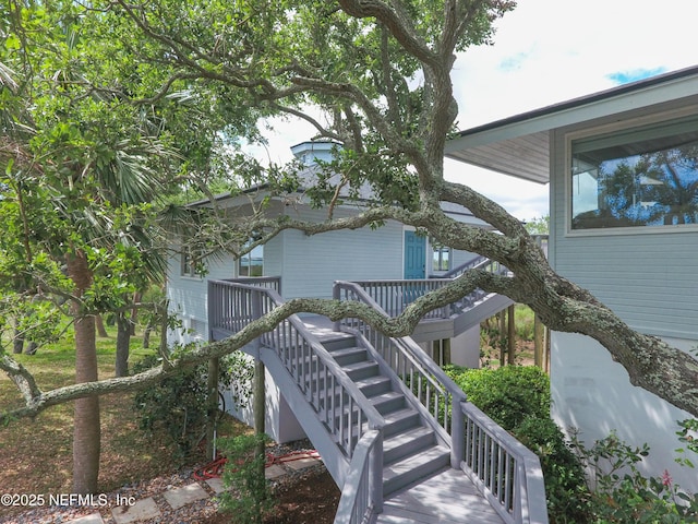 view of property exterior featuring stairs