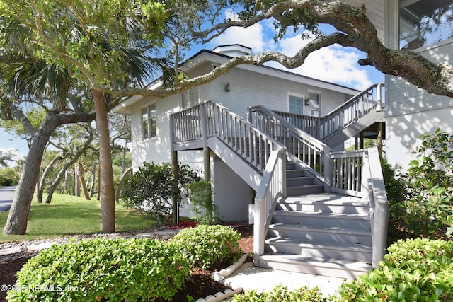 view of property exterior with stairway